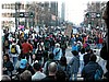 Looking in the direction of the march's beginning point, people continue to arrive, though the march was slated to have started 20 minutes earlier.