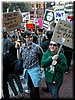 The girl in green: 'Will Suck Dick For Peace'. 