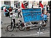 A biker's banner is tipped over by a slight wind - 'Stop the Oil Wars'