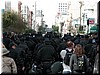 A group of police (perhaps riot) officers march away from Civic center attracted much attention by their rather military-like formation.