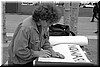 An activist making his sign in Civic Center