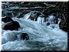 Rocks are smoothed by the gentle flow of water over thousands of years.